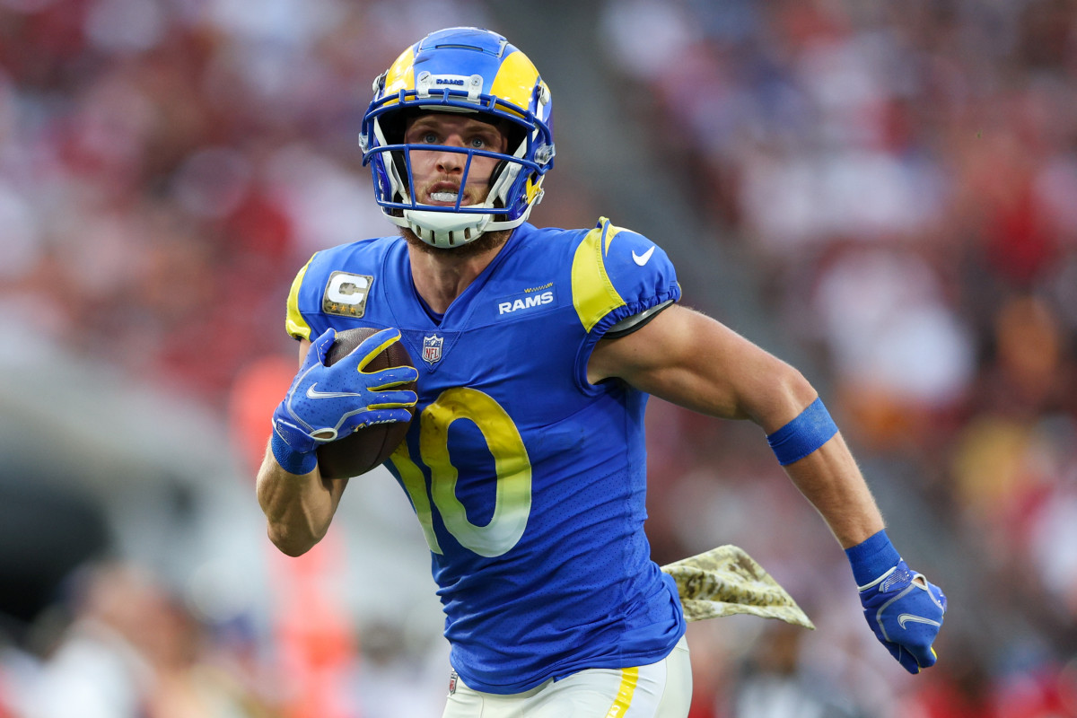 receiver Cooper Kupp runs with the ball in one hand